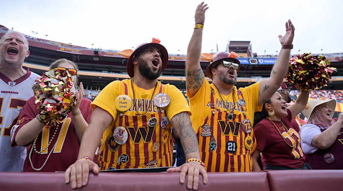 Commanders fan cheer at the first game with new owner Josh Harris